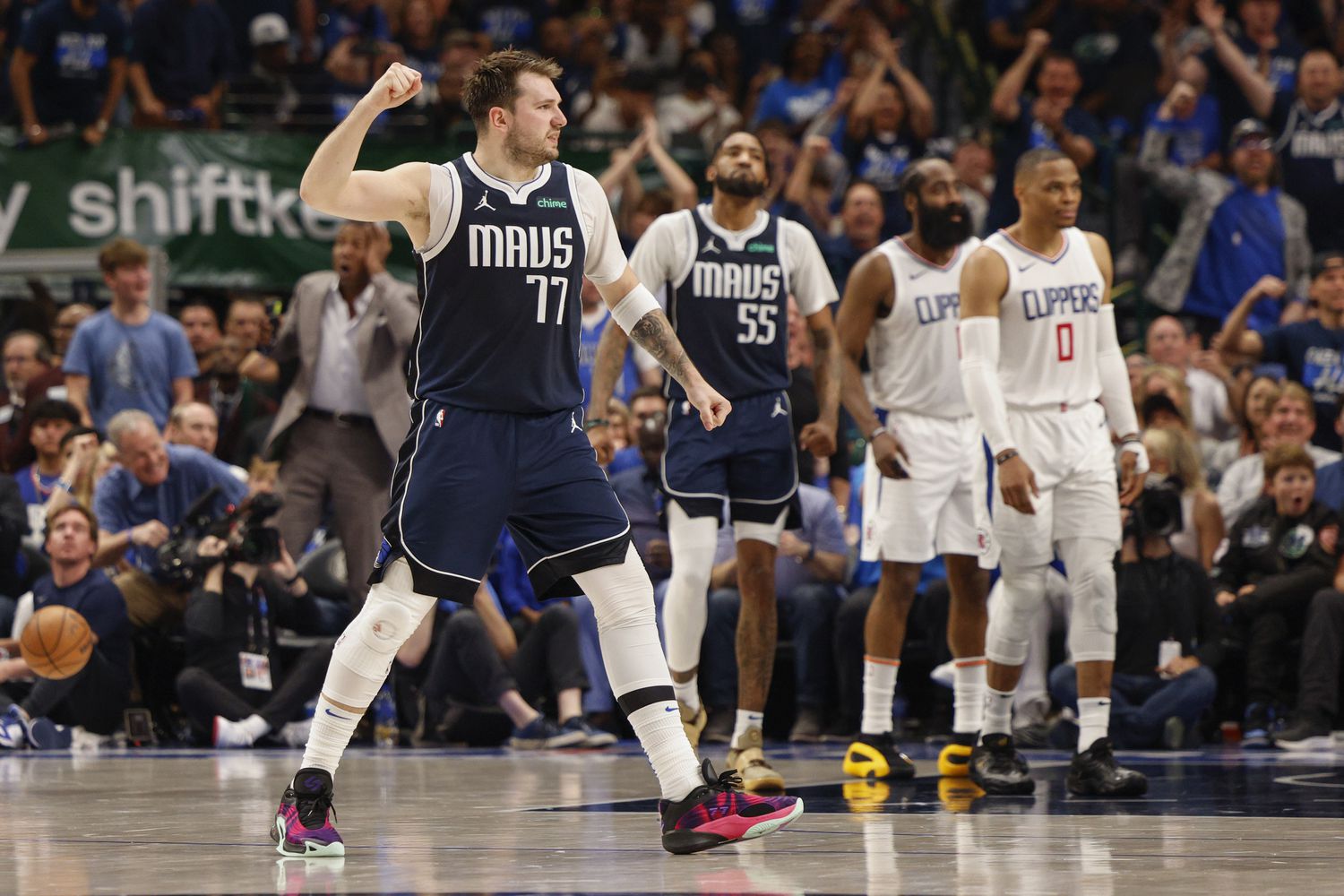 Dallas Mavericks guard Luka Doncic (77) reacts after a basket during the first half of Game...