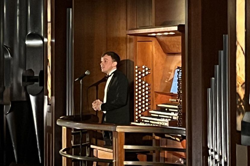Organist Thomas Ospital talks to the audience at his Meyerson Symphony Center recital on...