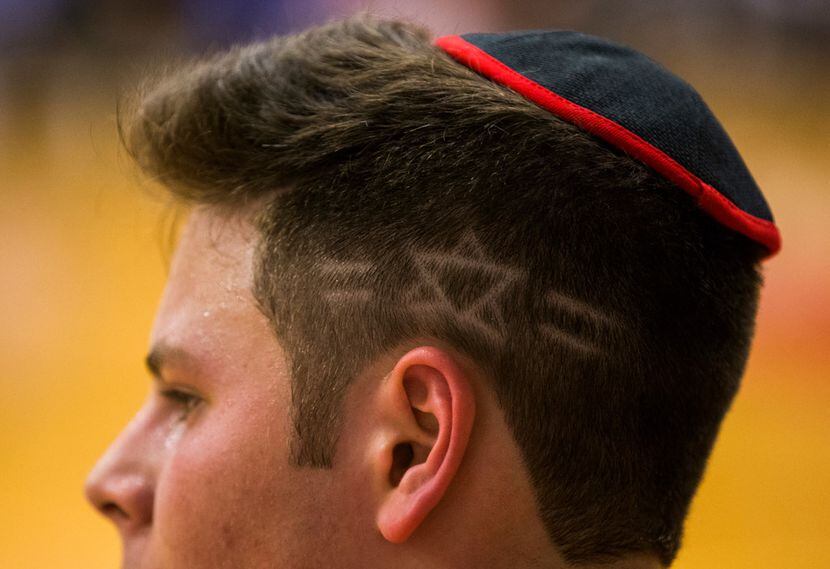 Yavneh's Jonah Eber (4) has a star of David etched in to his hair during a high school boys...