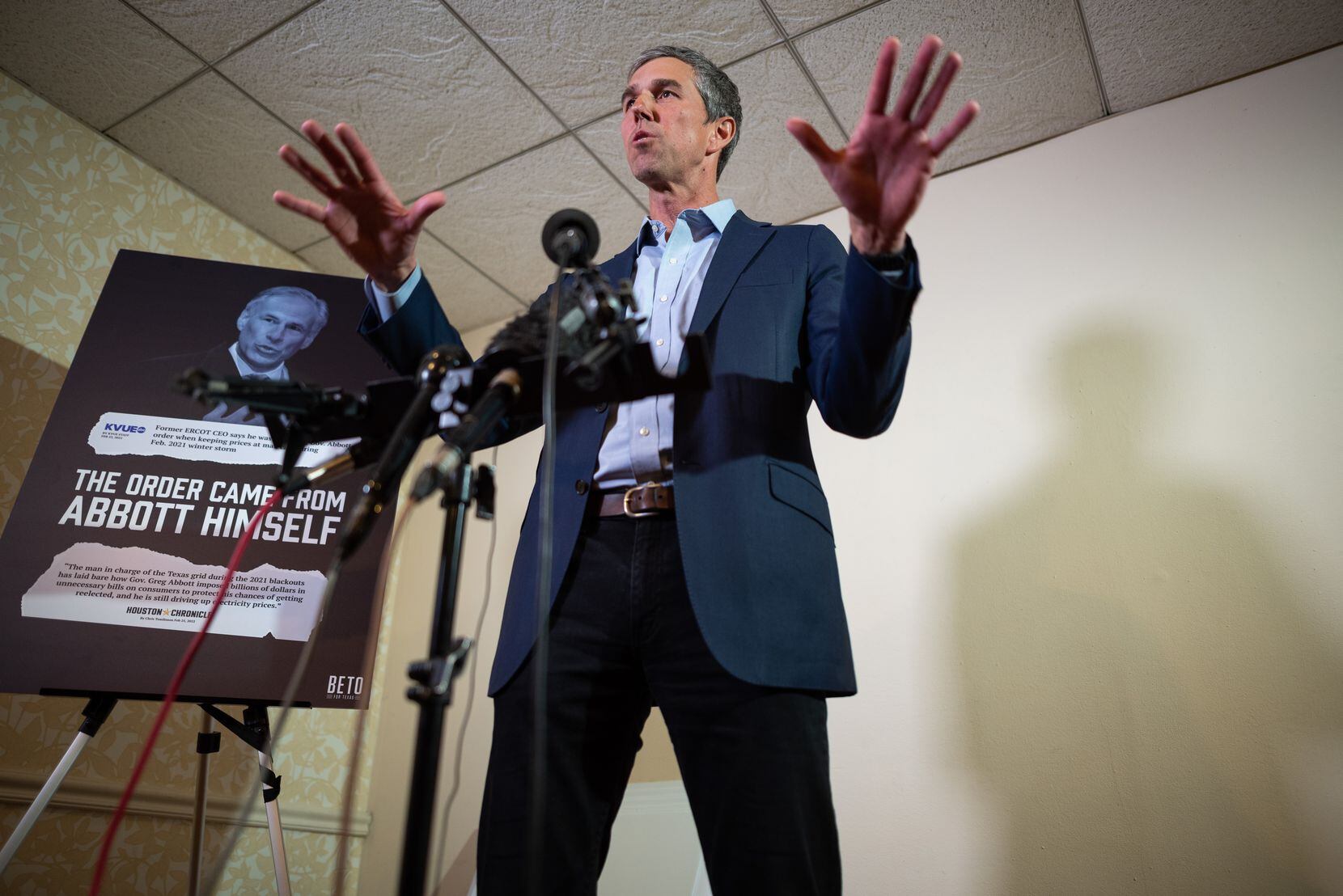 Beto O'Rourke, democratic candidate for Governor, stands next to an image of Texas Governor...