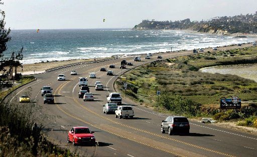 Motorists drive along California's Historic Highway 101 as it passes through...