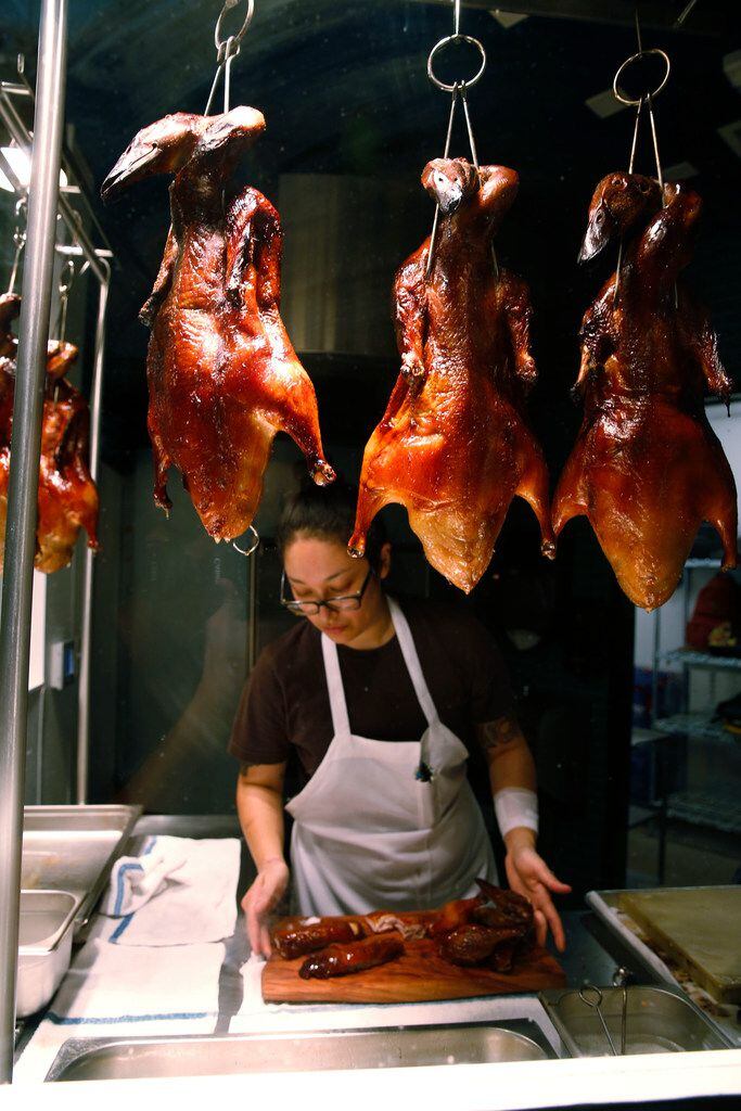 Chef Angela Hernandez prepares Cantonese roast duck.