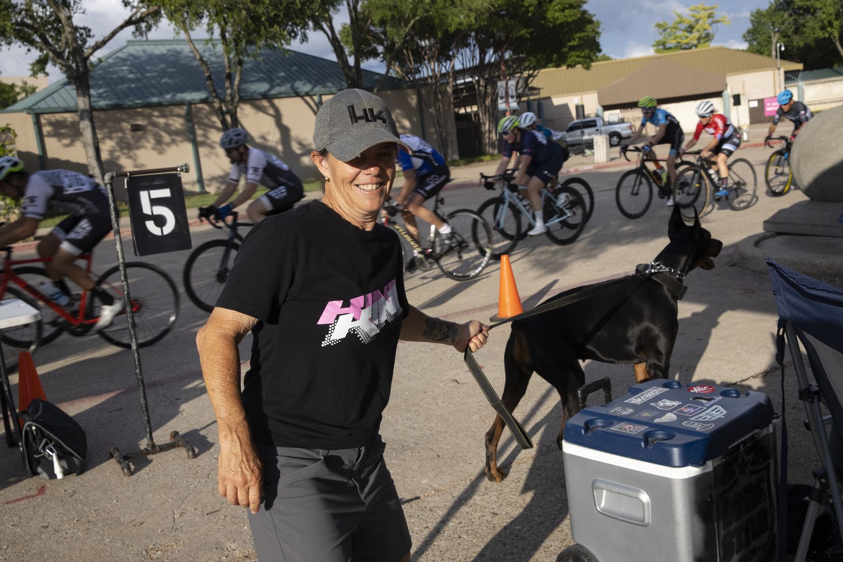 Ginny King founder of King Racing Group walks around as cyclists compete at Fair Park on Thursday, May 20, 2021, in Dallas. 
