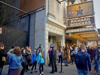 In this 2016 file photo, people line up to see the Broadway play Hamilton in New York.