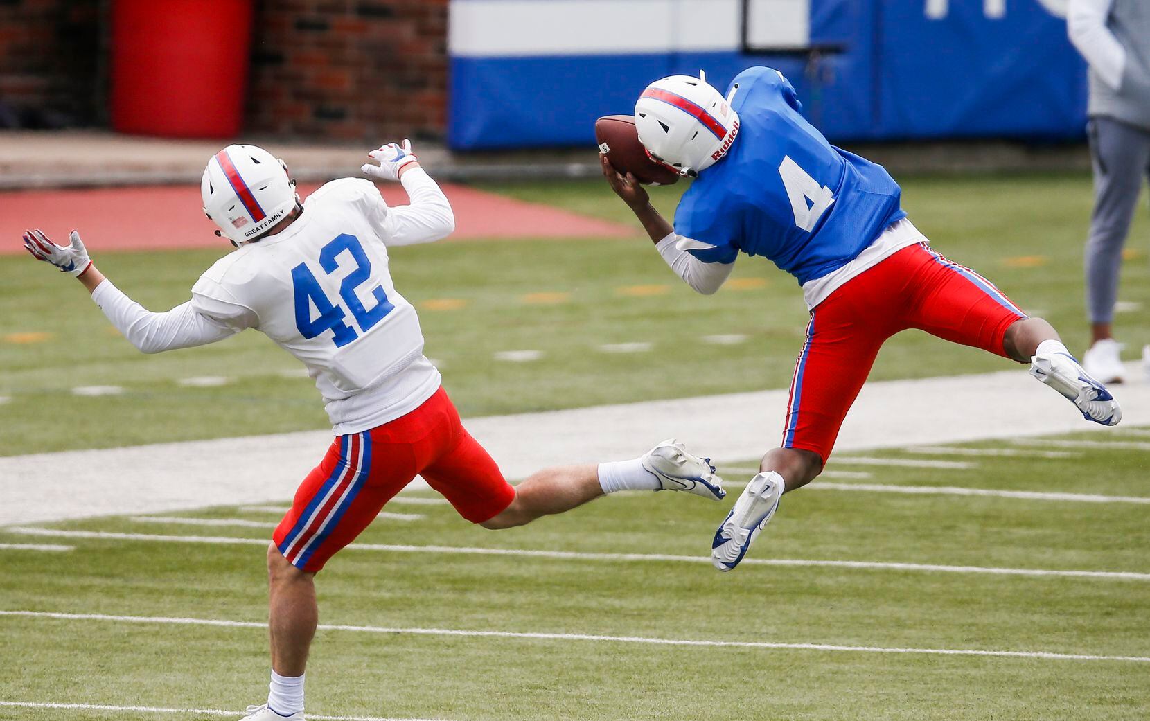 SMU safety Bryce McMorris (4) intercepts a pass intended for SMU wide receiver Beau Barker...