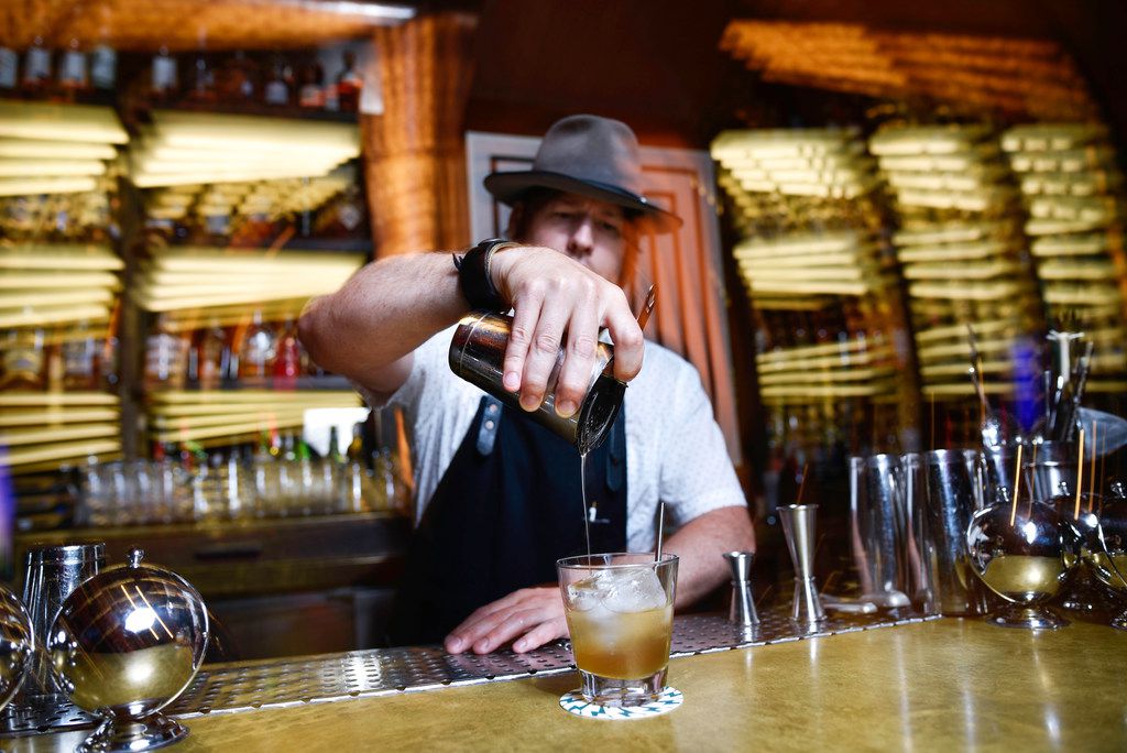 Co-creator Chad Solomon, of the Midnight Rambler bar, mixes a Cuffs and Buttons cocktail...