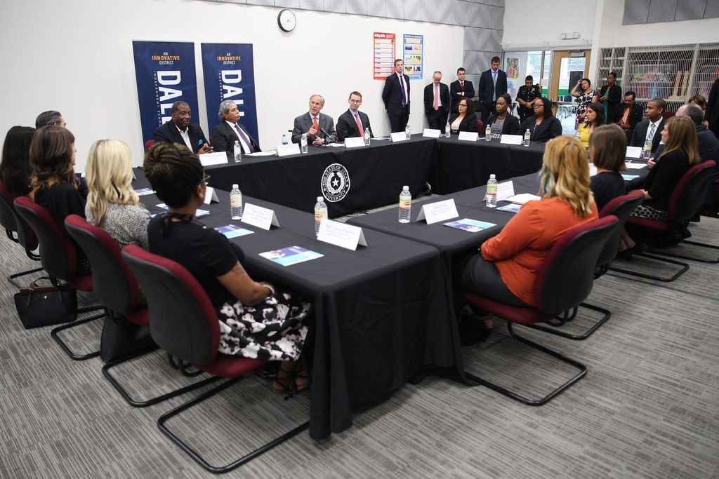 Governor Greg Abbott meets with teachers and school administrators during a visit to Dallas...