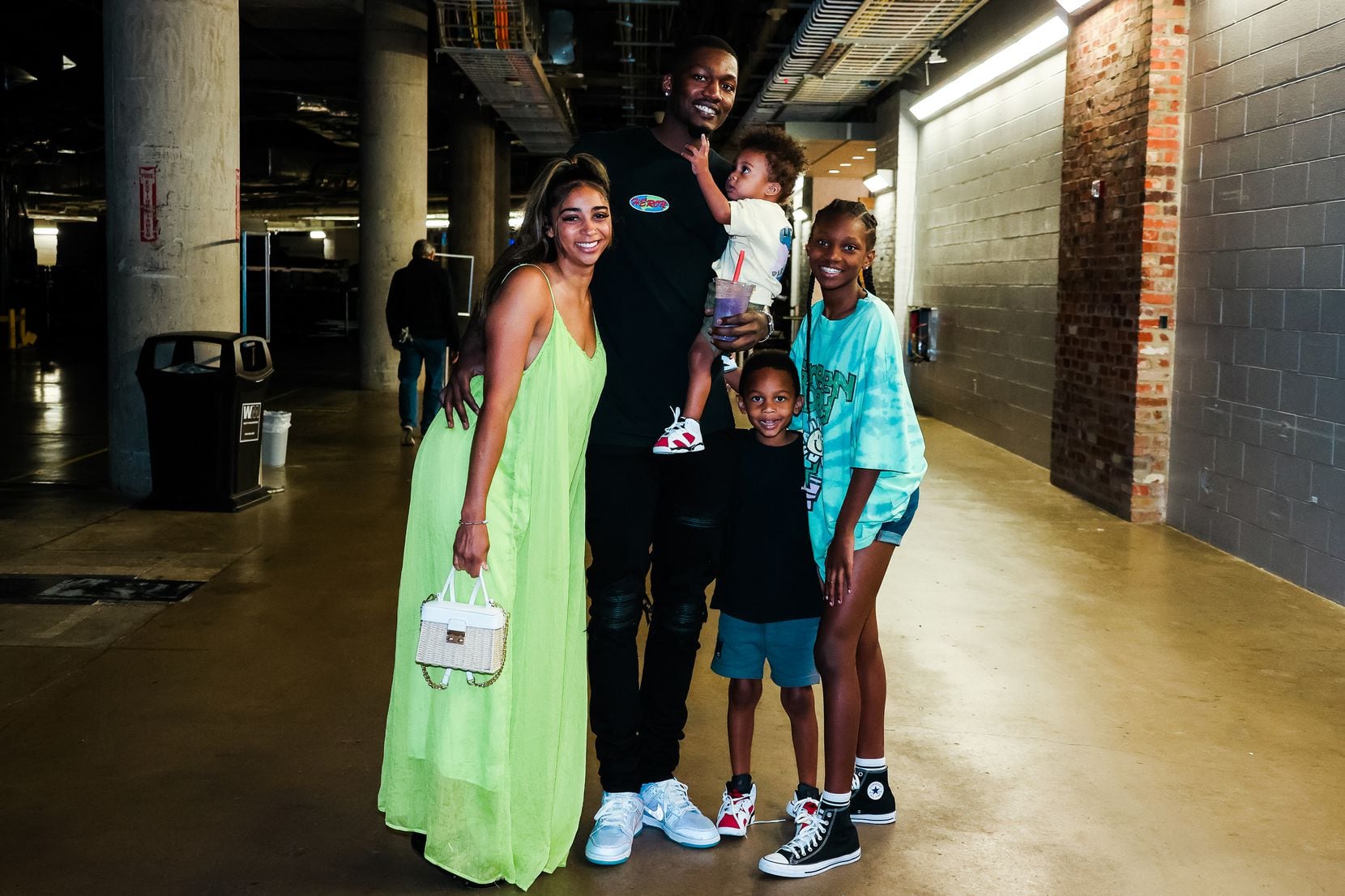 Mavericks forward Dorian Finney-Smith poses with his family — girlfriend JazMyne, sons Aysen...