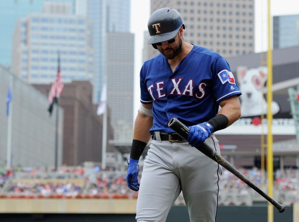MINNEAPOLIS, MN - JUNE 24: Joey Gallo #13 of the Texas Rangers walks back to the dugout...