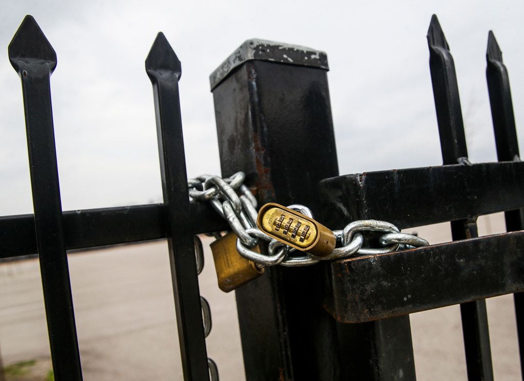 A combination lock ensures the parking lot stays empty in the 2200 block of Burbank Street...