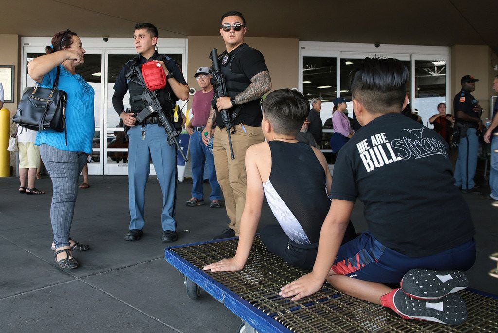 Police interview witnesses at Sam's Club where Walmart shoppers were evacuated near the...