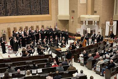 Artistic director James Richman (at the harpsichord) led the Dallas Bach Society Chorus and...