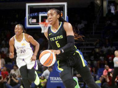 Dallas Wings forward Kayla Thornton (6) races to the basket during a first half fast break...