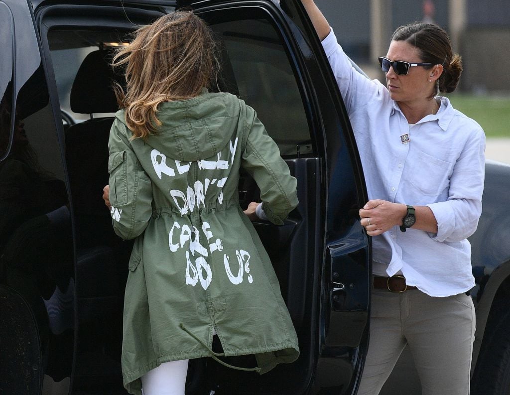 First Lady Melania Trump wears a coat that says 