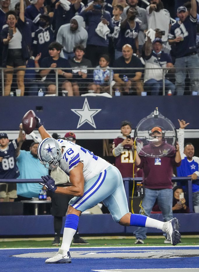 Dallas Cowboys offensive tackle Terence Steele (78) spikes the ball after scoring on a...