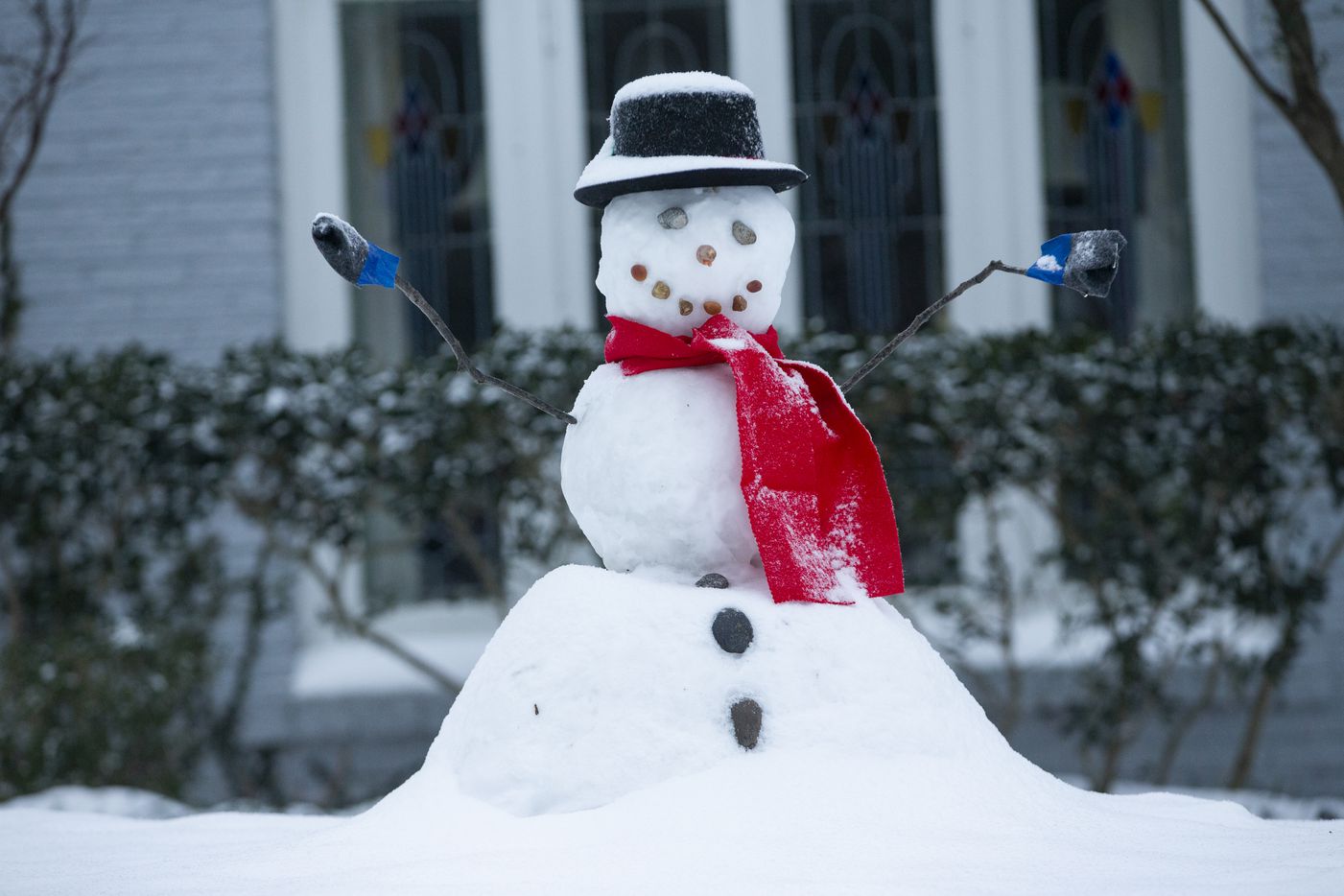 A snowman in Lower Greenville sits with fresh snow on its head in Dallas on Wednesday, Feb. 17, 2021. Millions of Texans have lost power amid this record-breaking winter storm.