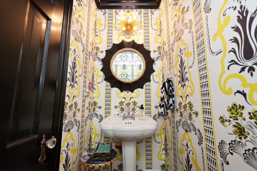 A tiny powder bath gets a serious shot of style with wallpaper Lauren Renfrow picked, with...