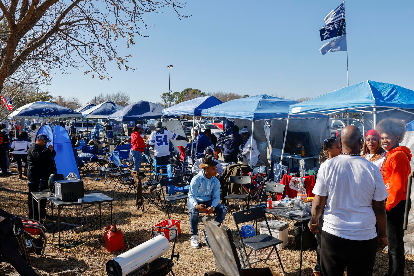 Dallas Cowboys fans tailgate before an NFL wild-card playoff game between the Dallas Cowboys...