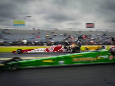 Madison Payne (top) races Matthew Cummings in a Top Alcohol Dragster semifinal at the Texas...