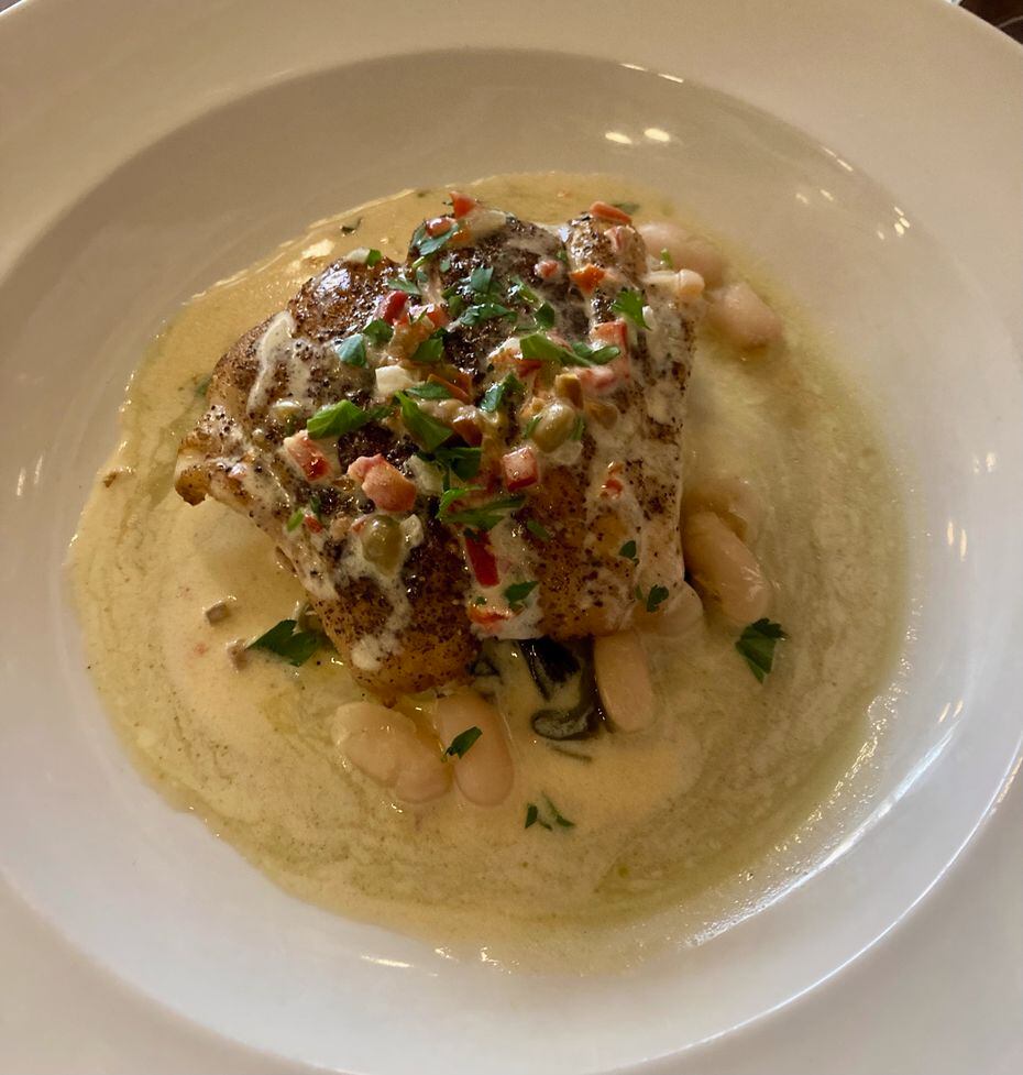 Nonna's Gulf red snapper is served in a creamy butter sauce with pickled cherry peppers and...