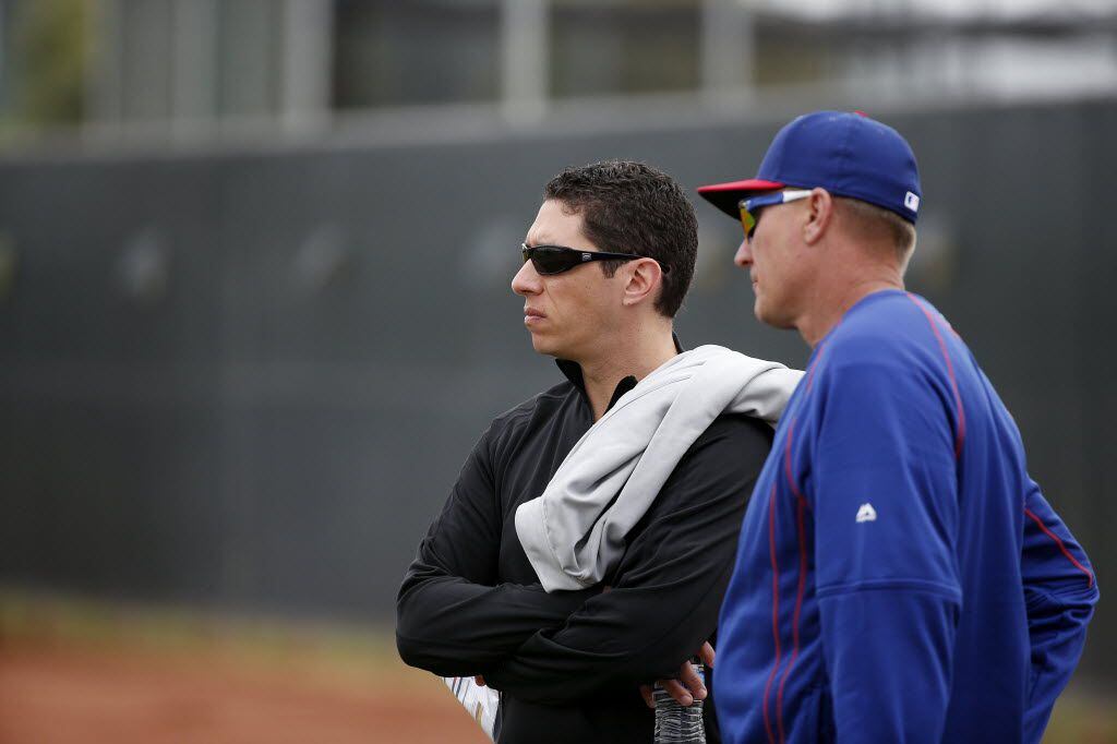 Texas Rangers general manager Jon Daniels (left) and manager Jeff Banister watch batting...