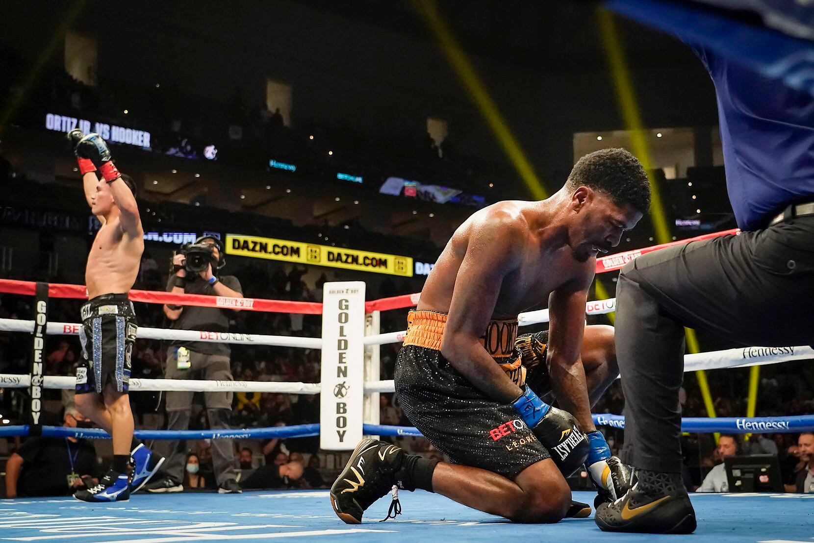 Vergil Ortiz Jr. (left) celebrates his victory over Maurice Hooker (right) for the vacant WBO international welterweight title as the referee calls the fight at Dickies Arena on Saturday, March 20, 2021, in Fort Worth.