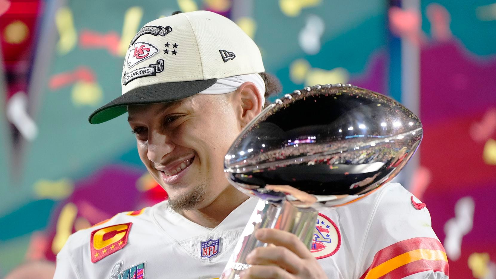 Kansas City Chiefs quarterback Patrick Mahomes (15) holds the trophy after their win against...