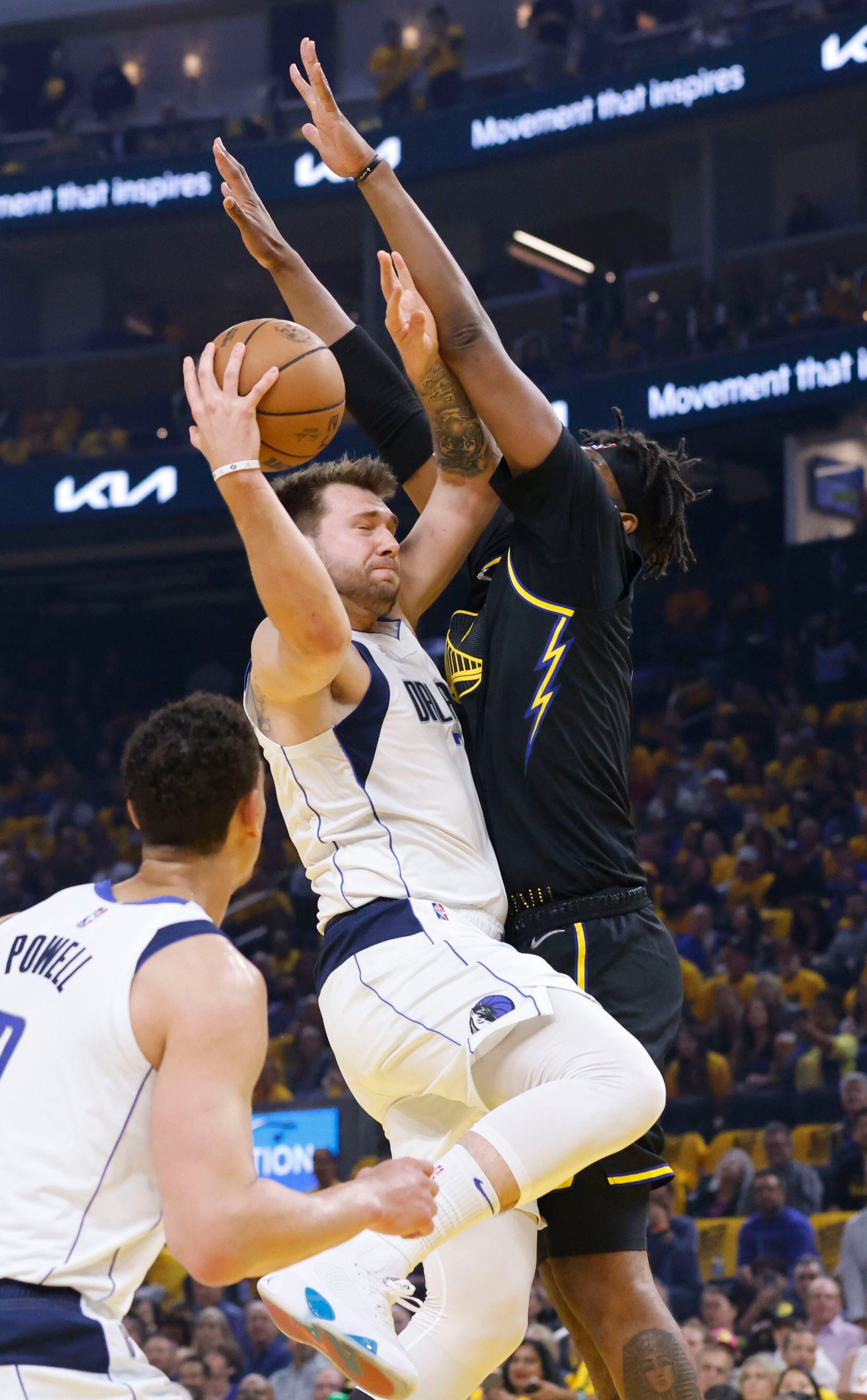 Dallas Mavericks guard Luka Doncic (77) attempts a shot as Golden State Warriors center...