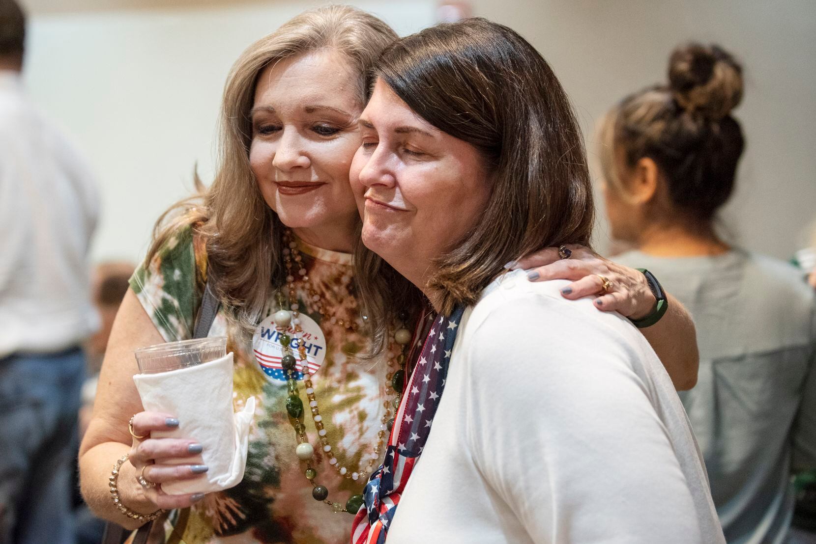 Susan Wright (right), 6th Congressional District candidate, was hugged by friend and Republican supporter Richelle Smithee as Wright met with friends and family during an election night watch party at the Courtyard by Marriott hotel in Arlington on Tuesday.