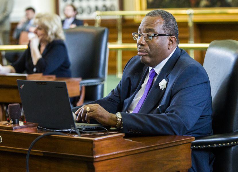 Sen. Royce West, D-Dallas, works at his desk during the final day of the 2015 Texas...