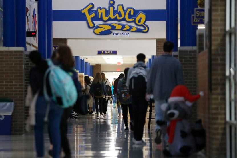 Students walk the halls at Frisco High School in Frisco.