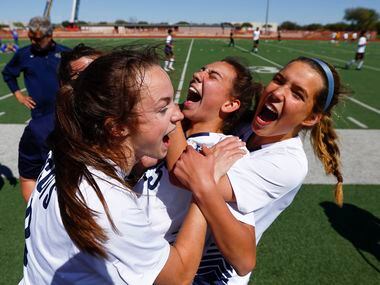 Highland Park’s Parker Buckroyd, center, is congratulated by teammates after scoring the...
