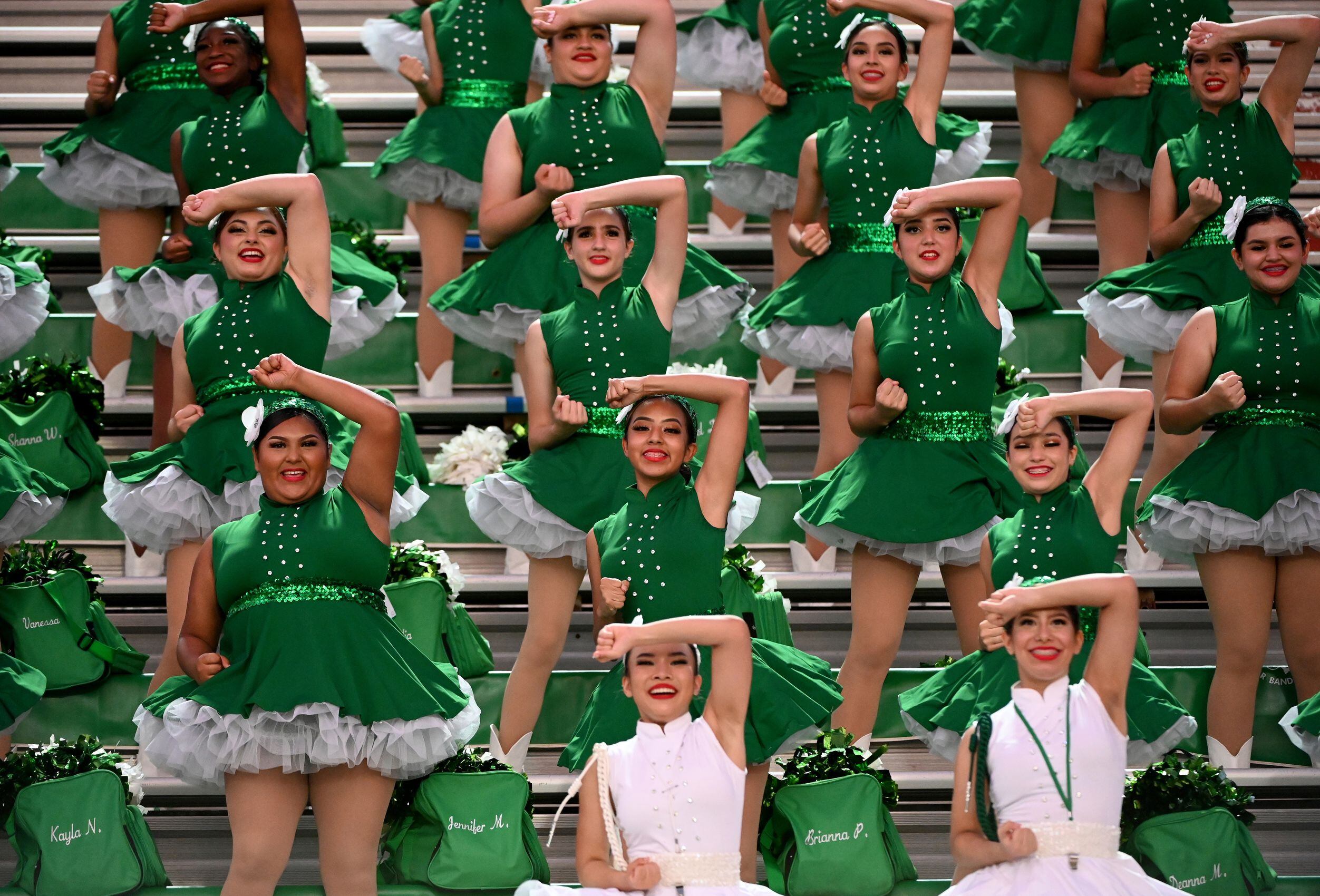 The Bryan Adams Belles perform in the first half during a high school football game between...