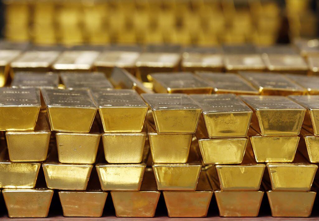 Gold bars are stacked in a vault at the U.S. West Point on Tuesday, July 22, 2014, in West...