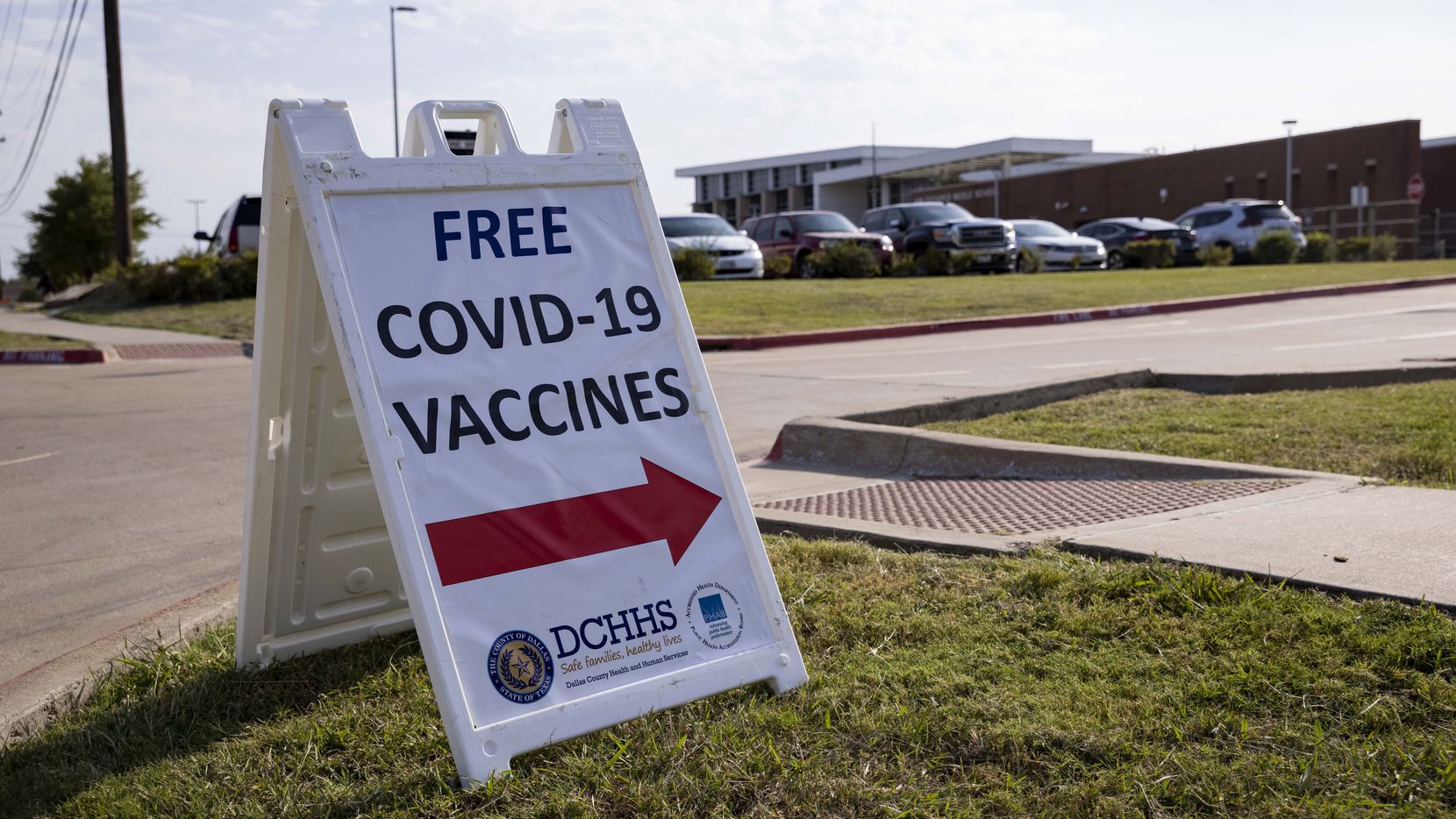 A sign announced a coronavirus vaccine clinic last month at Ann Richards Middle School in Dallas.