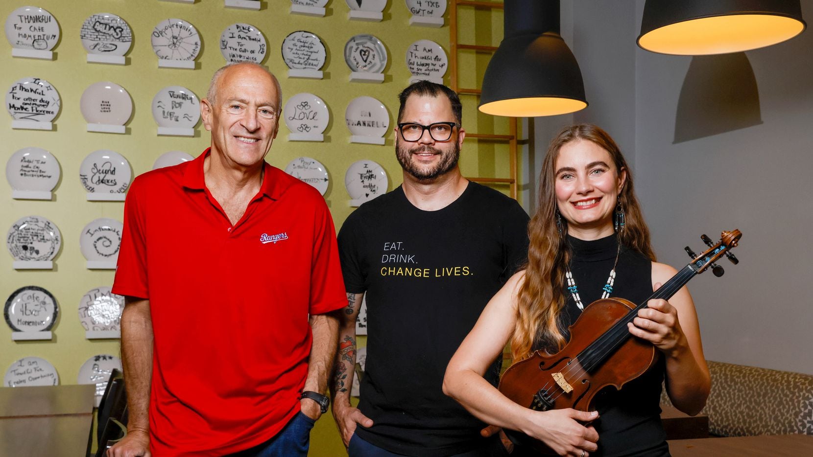 Broadcaster Eric Nadel (left), Café Momentum founder Chad Houser (center) and Grace Quebe of...