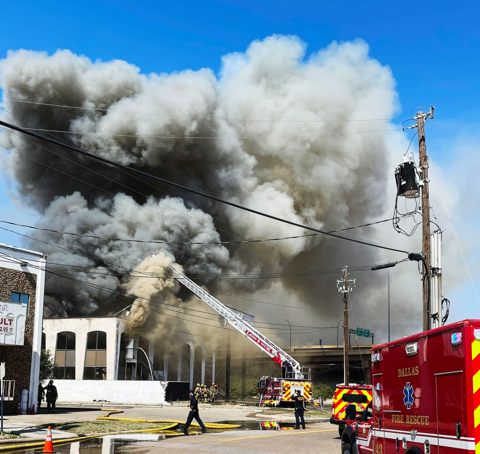 About 50 to 60 Dallas firefighters battled a blaze at a vacant two-story building in...