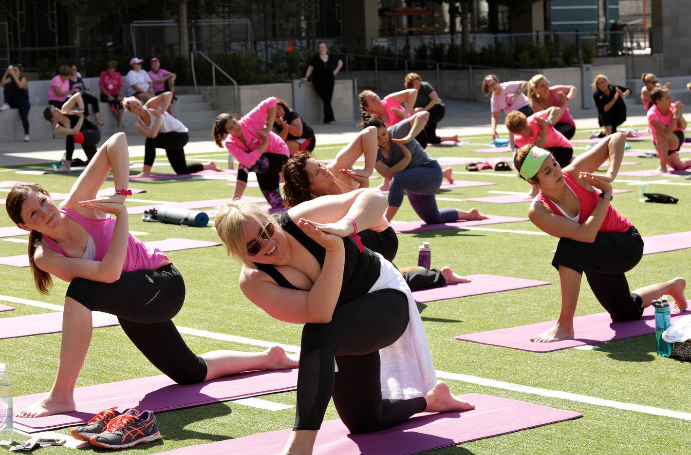 Susan G. Komen supporters participate in project:OM, a cancer research yoga event, held at...