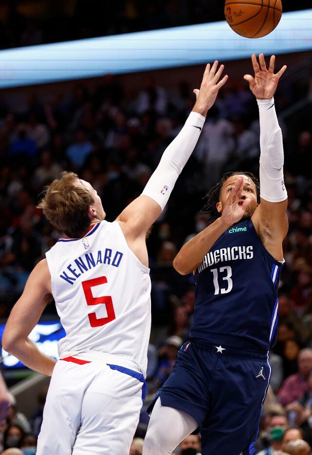Dallas Mavericks guard Jalen Brunson (13) attempts a shot as LA Clippers guard Rodney Hood (5) defends during the first half of an NBA basketball game in Dallas, Saturday, February 12, 2022. 
