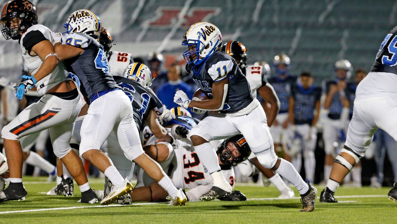 Sunnyvale RB Evan Johnson (11) picks up yardage during the first half of a high school...