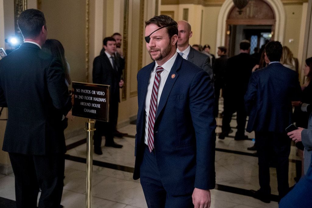 On the opening day of the American Conservative Union's annual four-day conference, House Minority Leader Kevin McCarthy praised Houston Republican Dan Crenshaw. Crenshaw walks through the halls on Capitol Hill in Washington, Wednesday, Jan. 16, 2019. (AP Photo/Andrew Harnik)