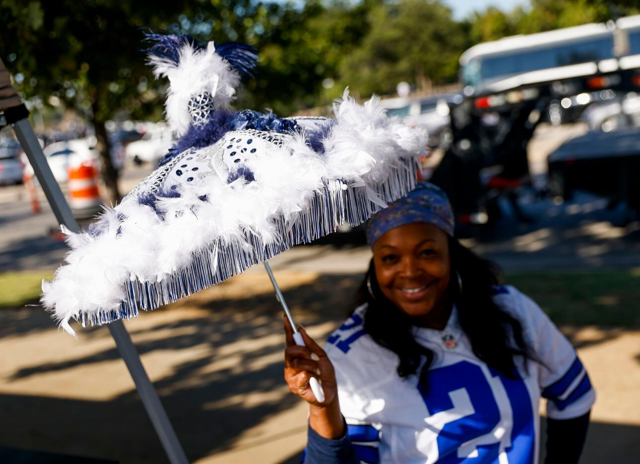 Alethea Peters from DeSoto poses with an umbrella made by a friend for her wedding as she...