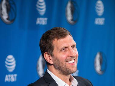 Former Dallas Mavericks player Dirk Nowitzki smiles while listening to a question during a...