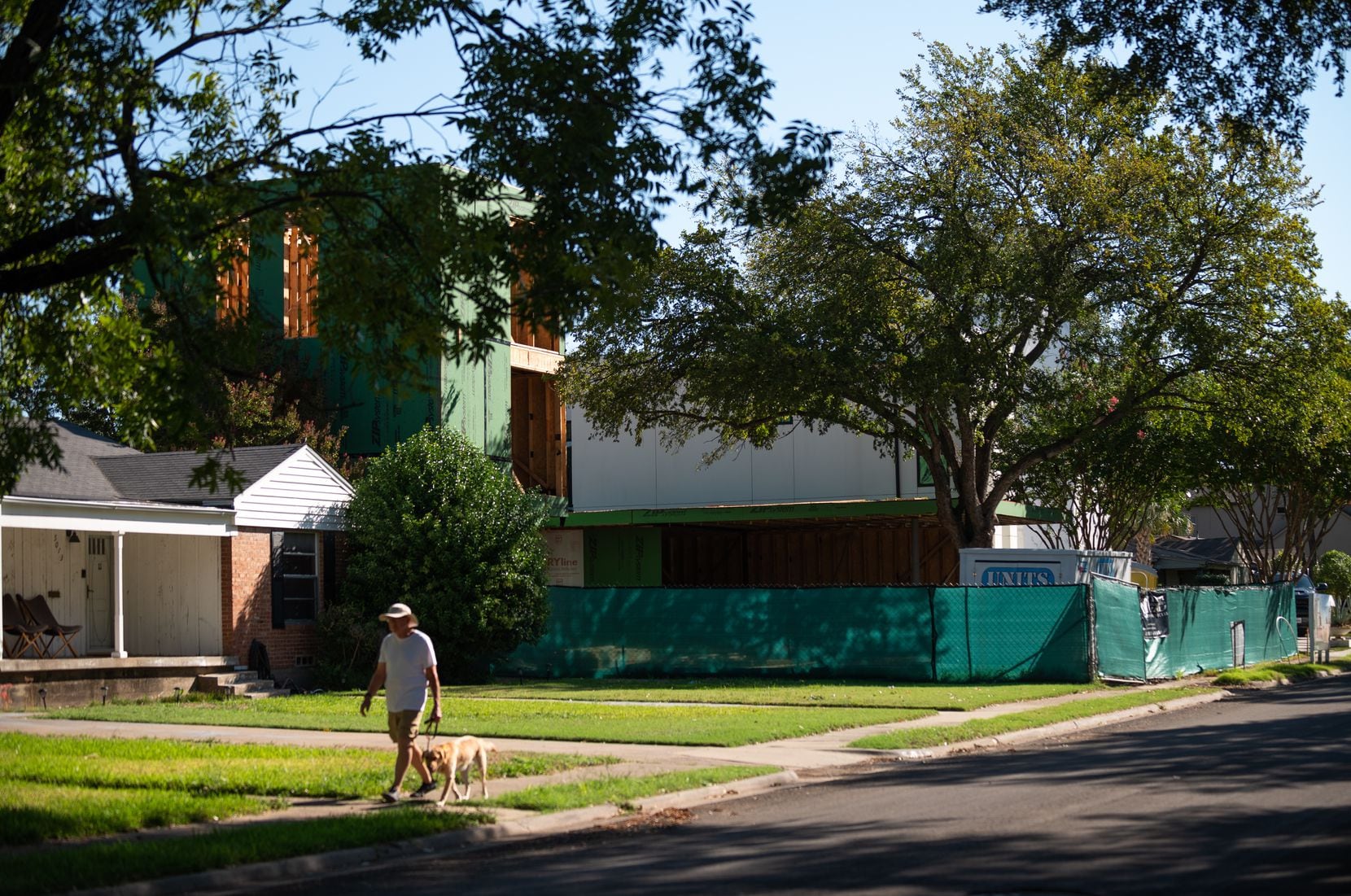 A three-story home is under construction between the "Tron" house on the corner of Wateka...