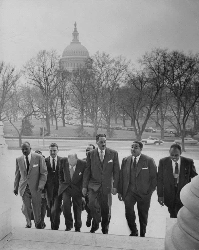 Thurgood Marshall (center) lawyer for the National Association for the Advancement of...