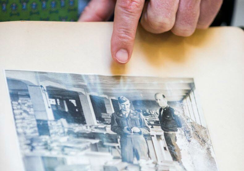 Monuments Men Foundation founder Robert M. Edsel points to a photograph, one  in a handmade...