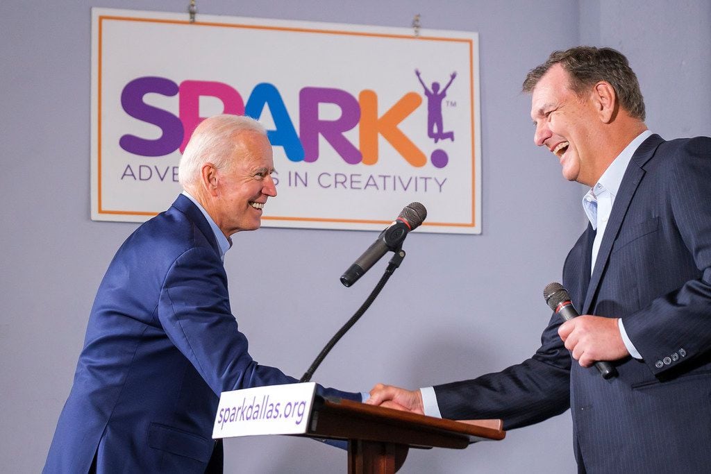 Democratic presidential candidate Joe Biden (left) shakes hands with Dallas Mayor Mike Rawlings as he is introduced to speak to participants in the Dallas Mayor's Intern Fellows Program as during a campaign event at SPARK! on Wednesday, May 29, 2019, in Dallas.
