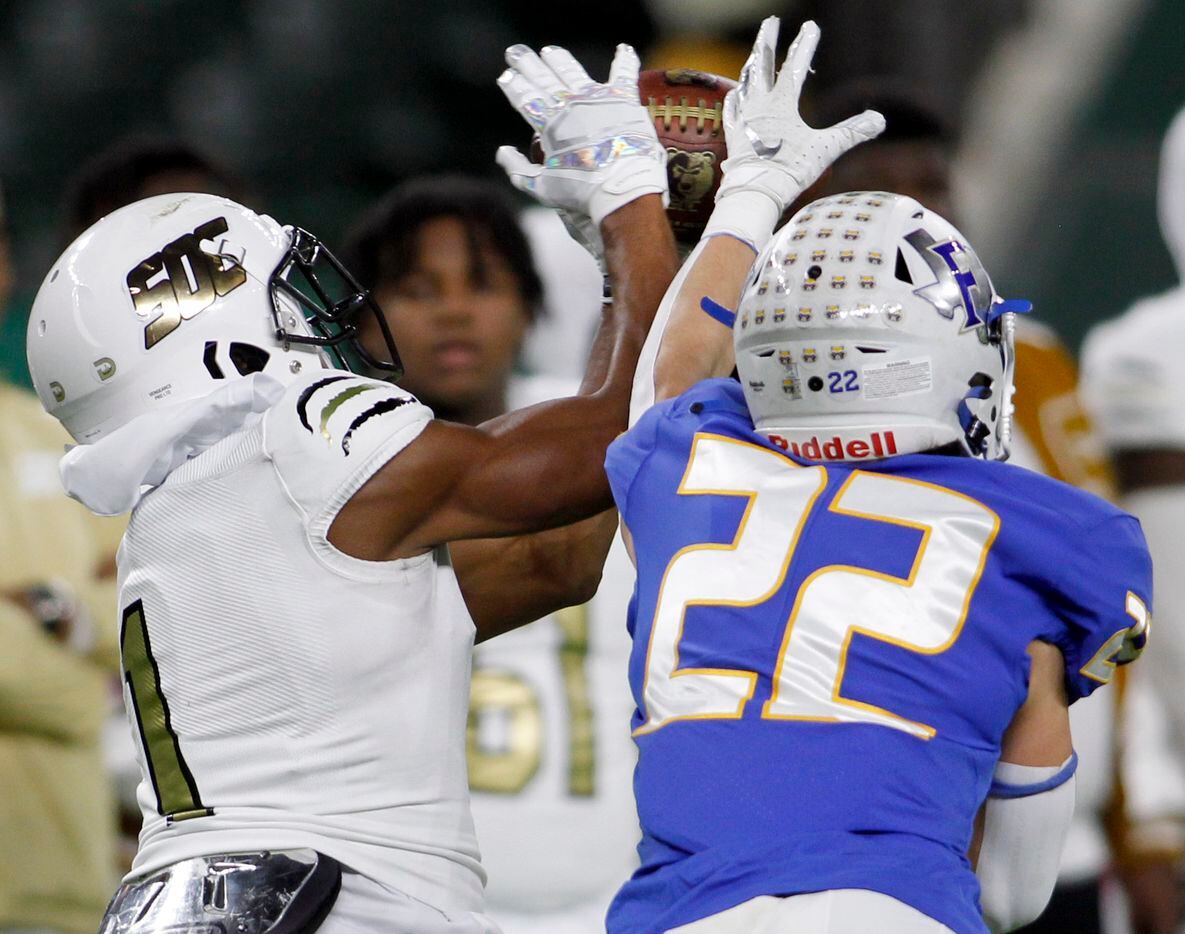 South Oak Cliff receiver Manny Muhammad (1) pulls in a reception despite the tight defensive...
