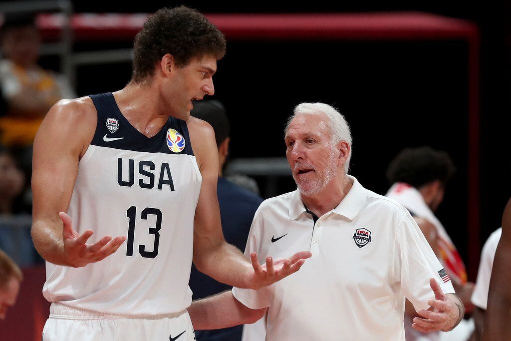 United States' coach Gregg Popovich chats with United States' Brook Lopez during a consolation playoff game against Poland for the FIBA Basketball World Cup at the Cadillac Arena in Beijing on Saturday, Sept. 14, 2019. U.S. defeated Poland 87-74 (AP Photo/Ng Han Guan)