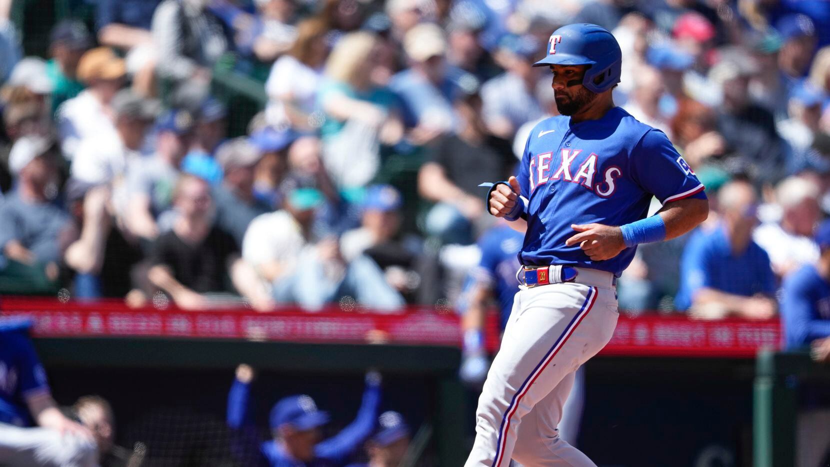 Texas Rangers' Ezequiel Duran scores on an RBI single by Marcus Semien during the sixth...